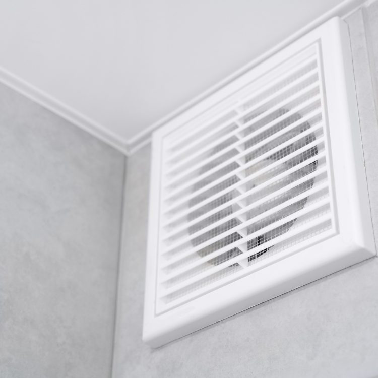 Home vent grille. Forced ventilation in a wall under the ceiling.